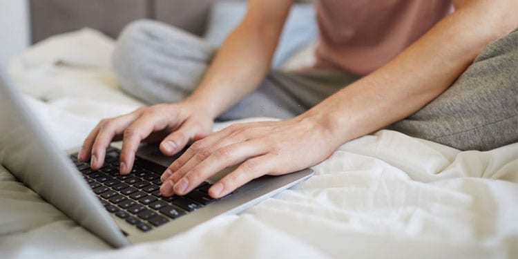 How To Safely Use Laptop On Bed Without It